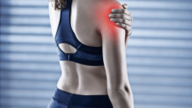 women holding shoulder as painful from DOMS